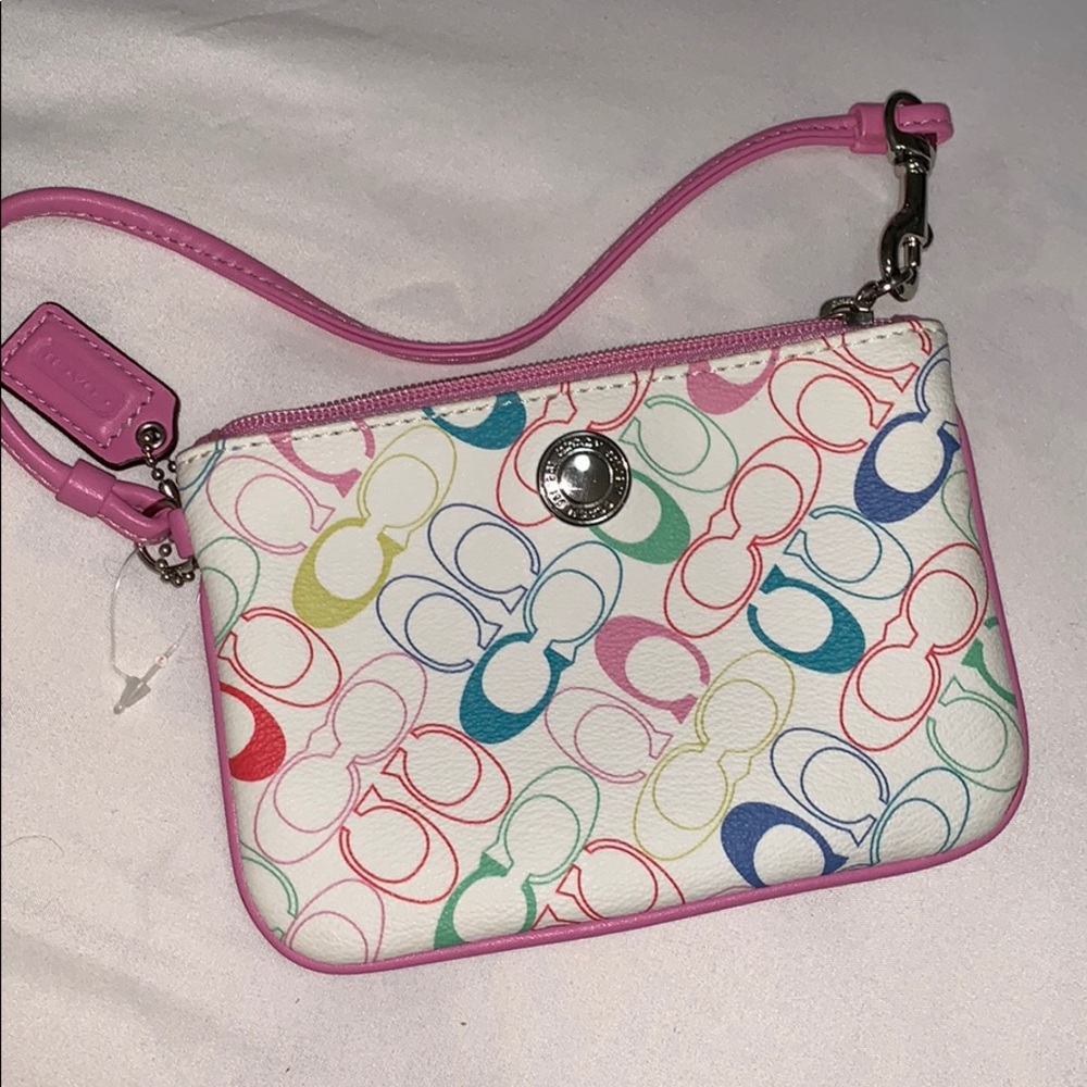 Coach wristlet with pink strap